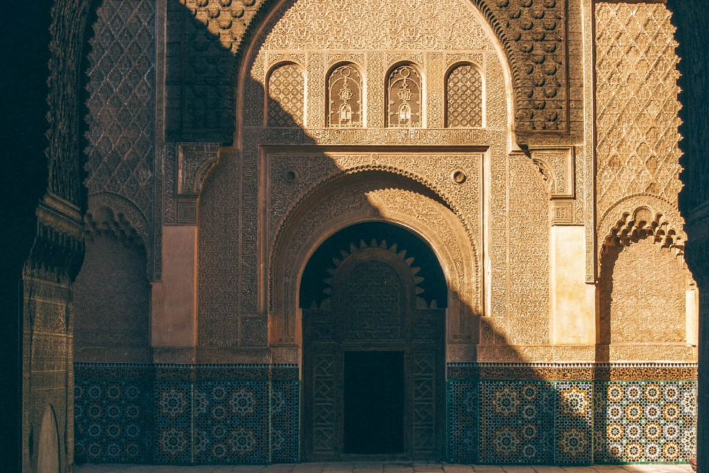 Carved stucco and cedar in the courtyard of the Ben Youssef Madrasa
