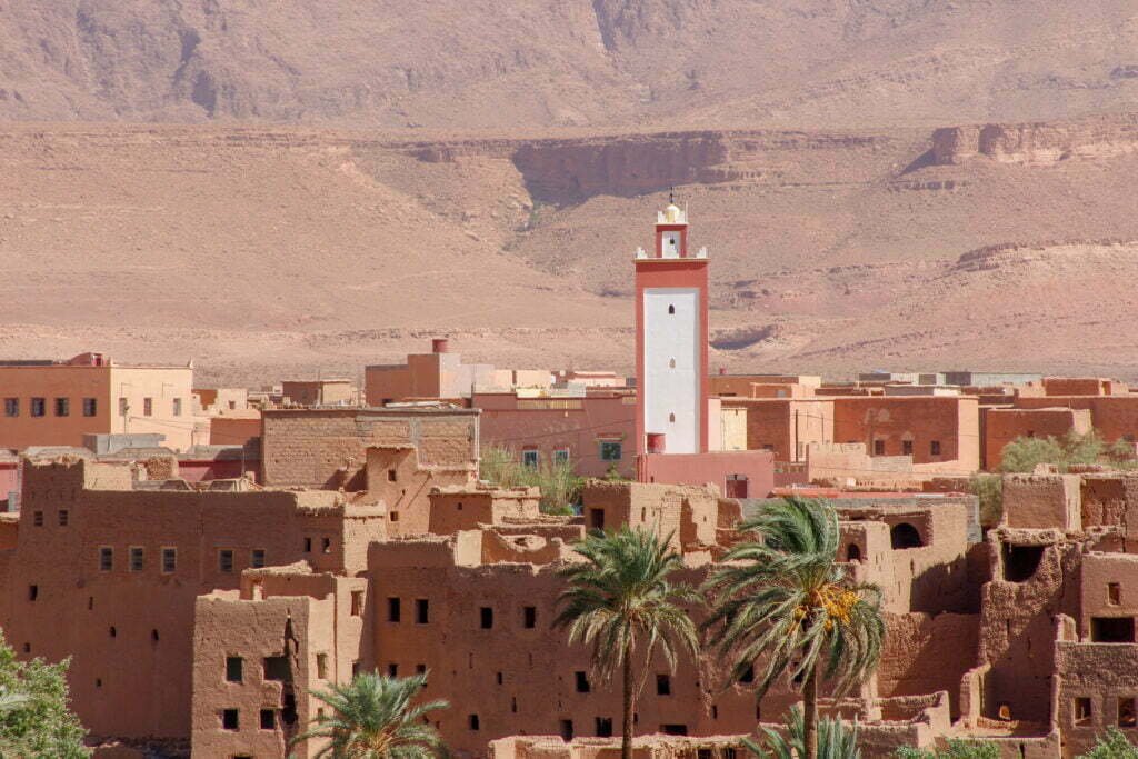 Village with a minaret in a desert valley of southern Morocco