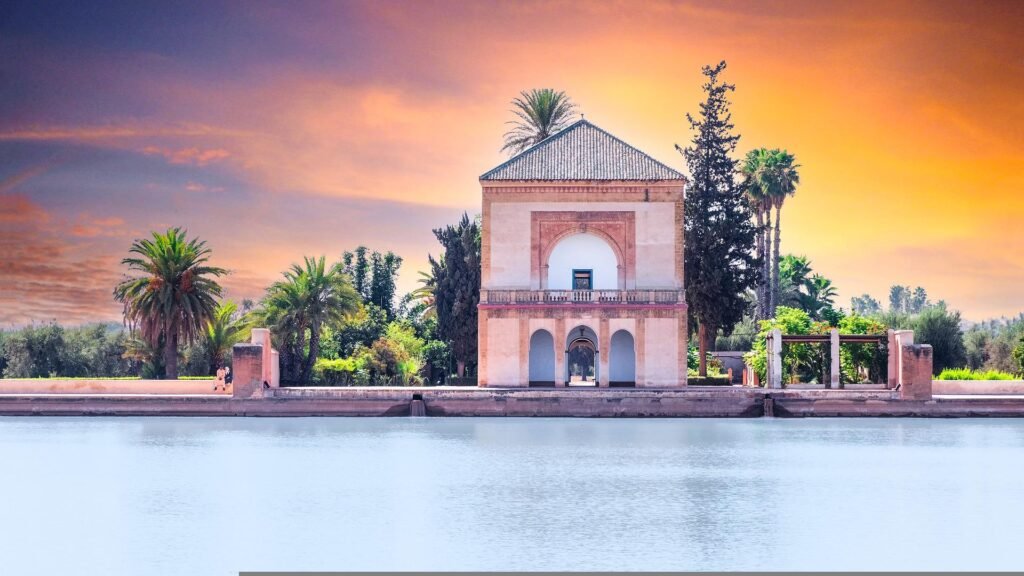 Menara Gardens pavilion and pool in Marrakech at sunset