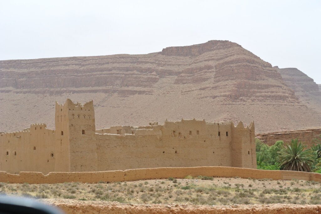 Earthen kasbah in the desert landscape of southern Morocco
